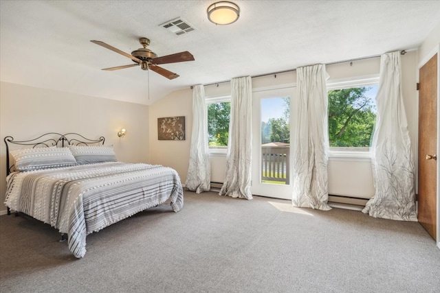 carpeted bedroom with a baseboard radiator, ceiling fan, vaulted ceiling, and access to exterior