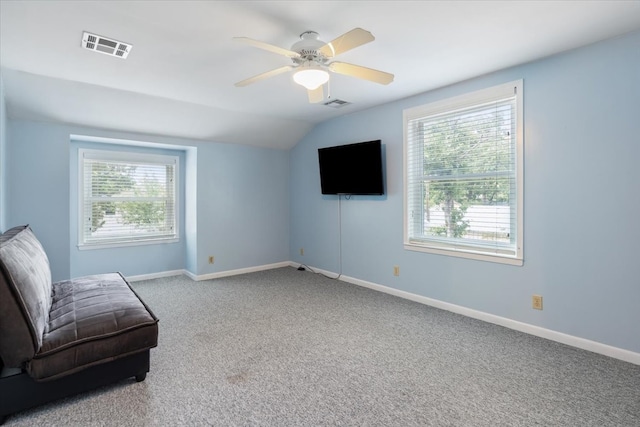 sitting room featuring carpet, ceiling fan, and vaulted ceiling