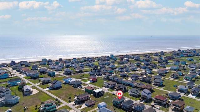 aerial view with a water view and a view of the beach