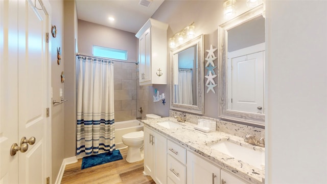 full bathroom featuring toilet, vanity, shower / bath combo, and hardwood / wood-style flooring