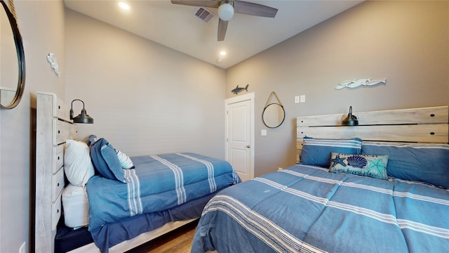 bedroom featuring hardwood / wood-style floors and ceiling fan