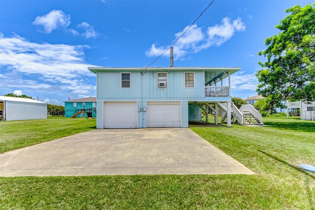 view of front of home featuring a garage and a front yard