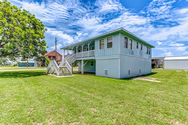 rear view of house with a lawn