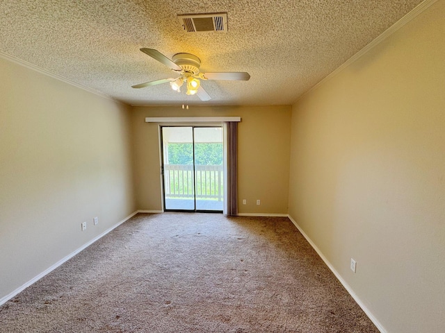 spare room with carpet, a textured ceiling, ceiling fan, and ornamental molding