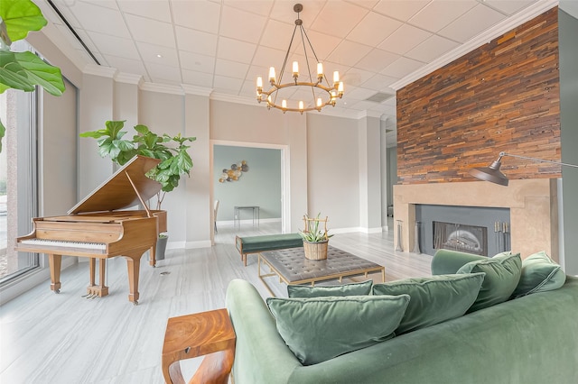 5150 Hidalgo St Unit 204, Houston, TX 77056 - living room featuring a chandelier, ornamental molding, wood finished floors, baseboards, and a large fireplace