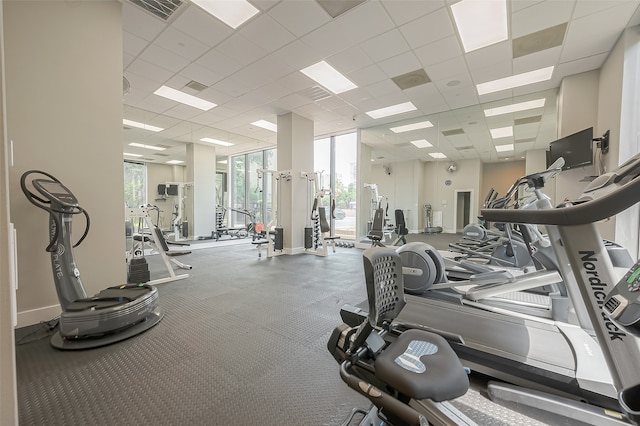 workout area with a drop ceiling