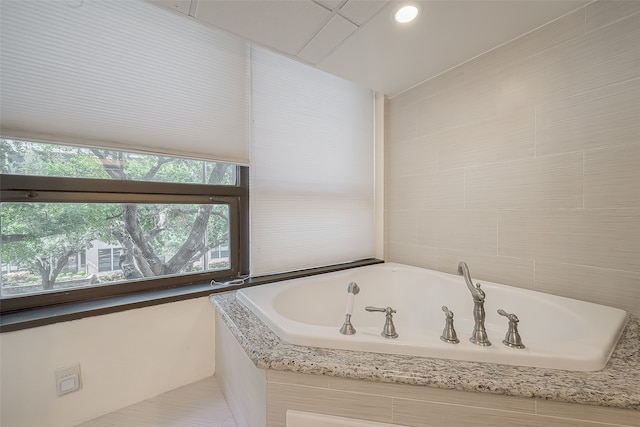 bathroom with tiled tub