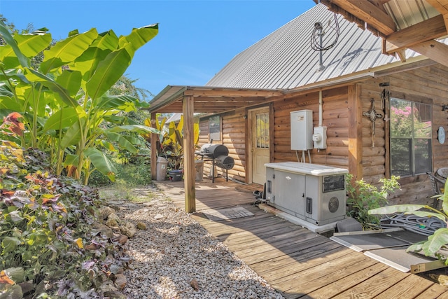 wooden terrace with a grill