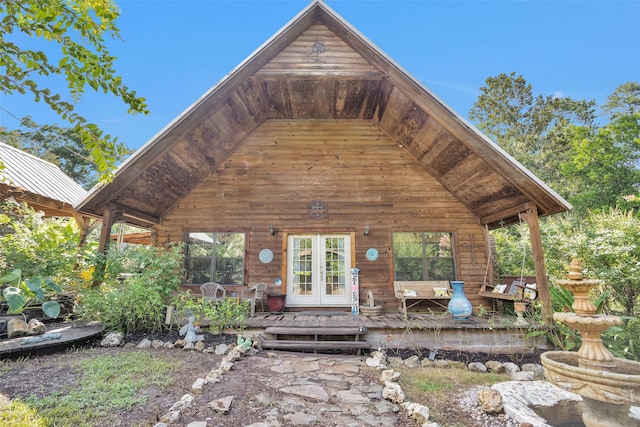 view of front of home featuring a wooden deck and french doors