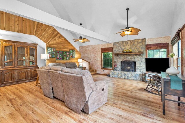 living room featuring a healthy amount of sunlight, light hardwood / wood-style flooring, and ceiling fan