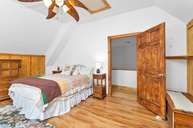 bedroom featuring lofted ceiling, light wood-type flooring, and ceiling fan