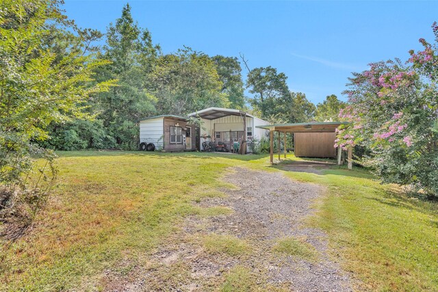 view of yard featuring a carport