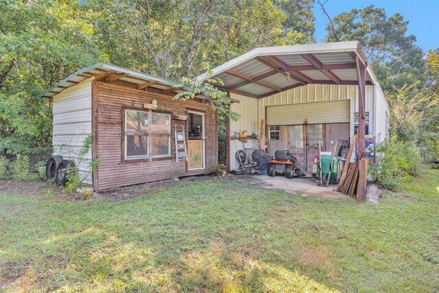 view of outdoor structure featuring a lawn