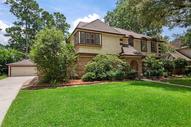 view of front of home featuring a front yard and a garage