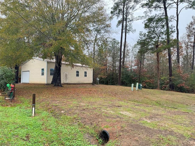 view of yard with a garage