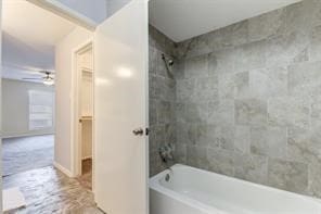 bathroom with tiled shower / bath and ceiling fan