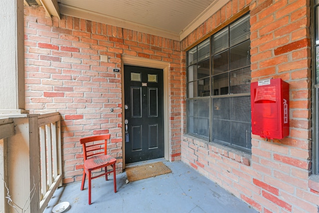 doorway to property featuring covered porch