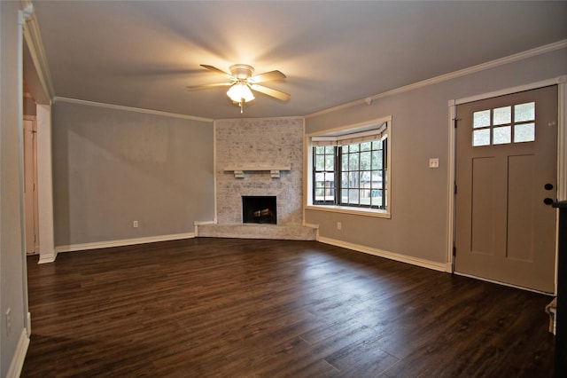 unfurnished living room featuring ceiling fan, dark hardwood / wood-style flooring, a fireplace, and crown molding