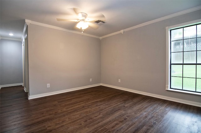 spare room with ceiling fan, dark hardwood / wood-style flooring, crown molding, and a wealth of natural light