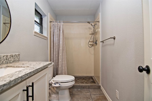 bathroom featuring tile patterned floors, a shower with curtain, toilet, and vanity