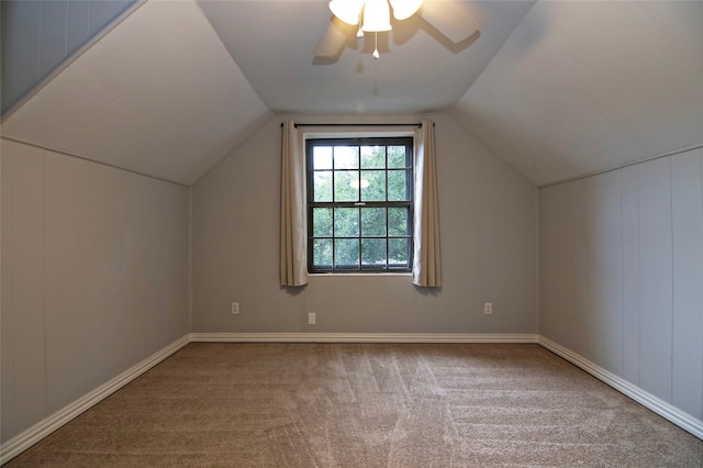 bonus room with ceiling fan, carpet floors, and vaulted ceiling