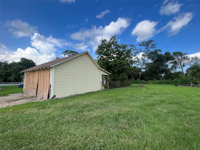 view of home's exterior featuring a yard