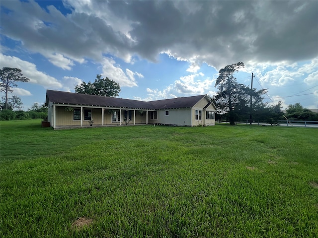 ranch-style home with a front lawn