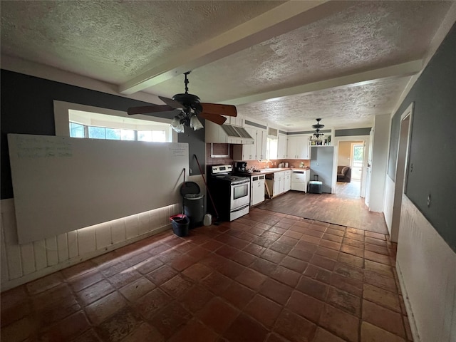 17102 River Rd, Channelview, TX 77530 - kitchen with a wealth of natural light, a ceiling fan, stainless steel appliances, and white cabinetry