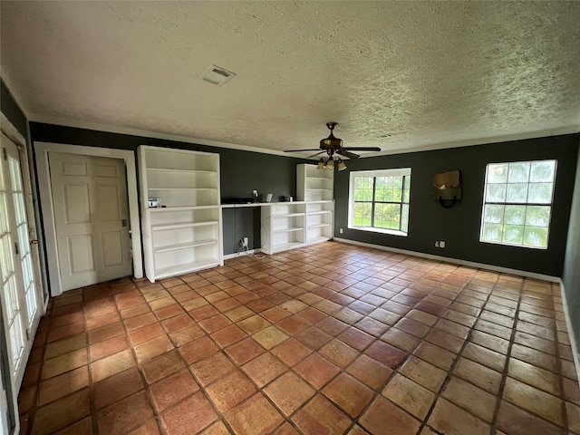 unfurnished living room with tile floors, a textured ceiling, built in shelves, and ceiling fan