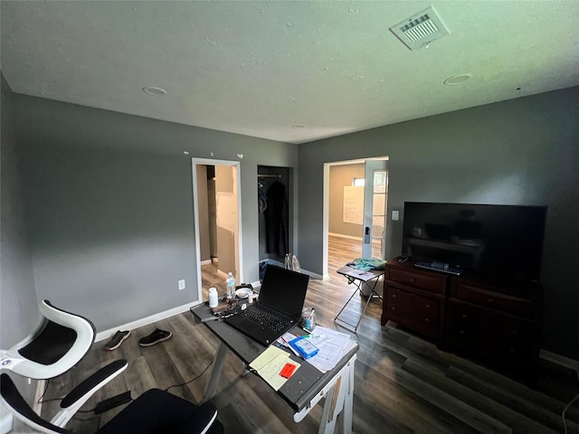 17102 River Rd, Channelview, TX 77530 - home office with baseboards, wood finished floors, and visible vents
