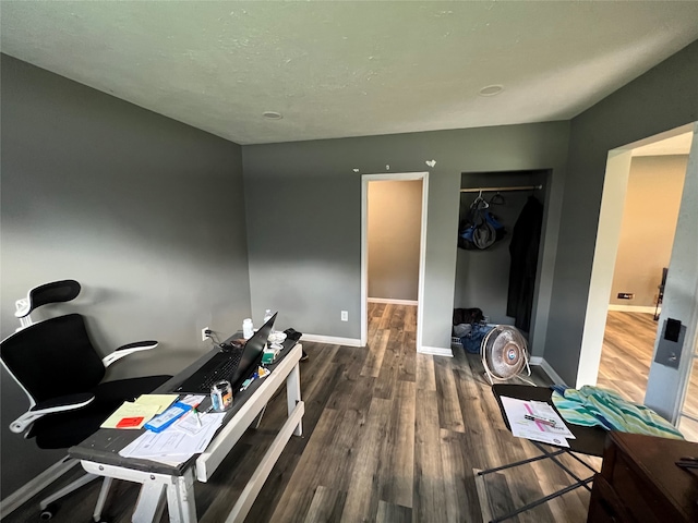 office area featuring dark wood-type flooring