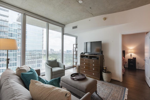 living room with floor to ceiling windows and dark wood-type flooring