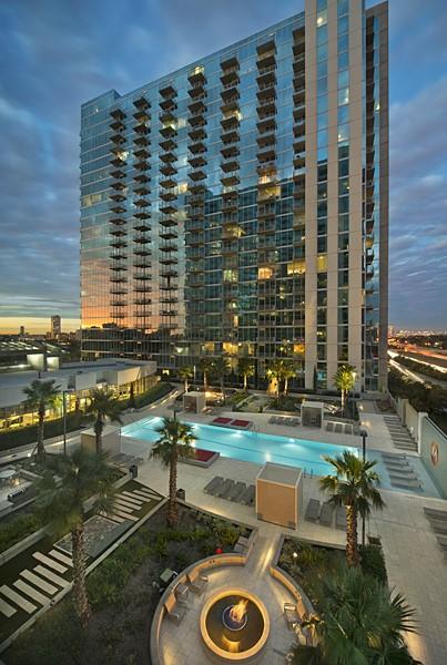 view of pool at dusk