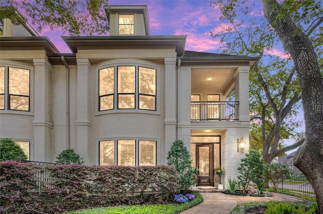 view of front of property with a balcony