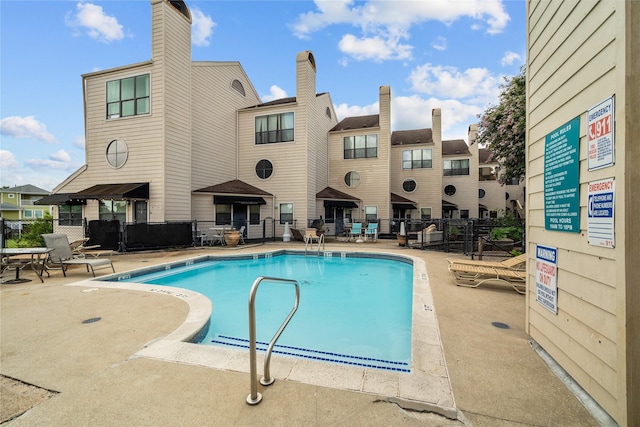 view of pool featuring a patio area