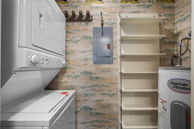 washroom featuring stacked washer / dryer, electric panel, and water heater