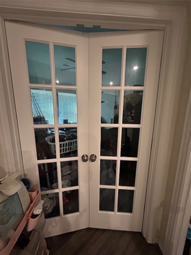 interior details with hardwood / wood-style flooring and french doors