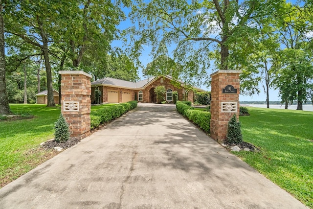 view of property's community featuring a yard and a water view