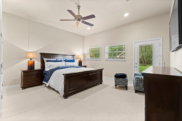 carpeted bedroom featuring access to outside and ceiling fan