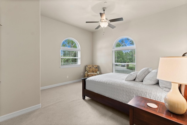 bedroom featuring ceiling fan and light colored carpet