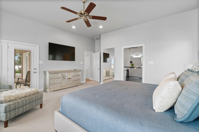 carpeted bedroom featuring ceiling fan, ensuite bathroom, and access to outside