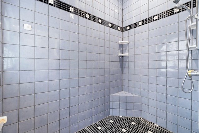 bathroom with tiled shower