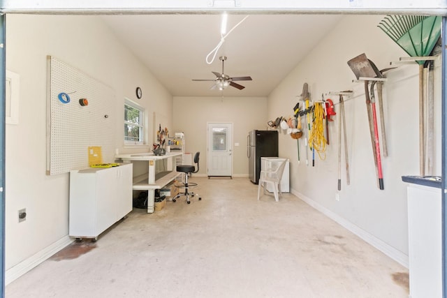 office space with ceiling fan and concrete flooring