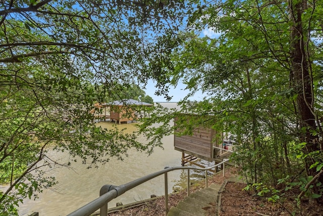 view of property exterior featuring a water view