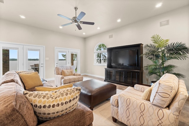 living room featuring ceiling fan and french doors