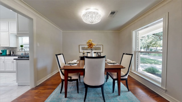 dining space with wood-type flooring and a wealth of natural light