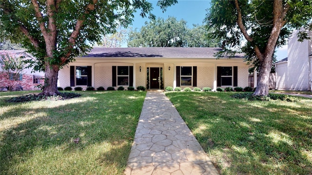 ranch-style home with a front lawn