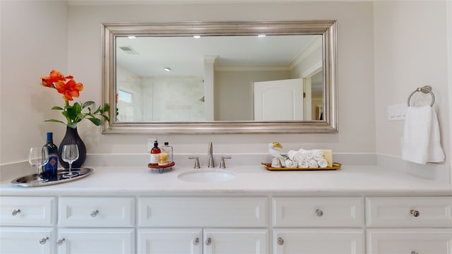 bathroom featuring vanity and crown molding