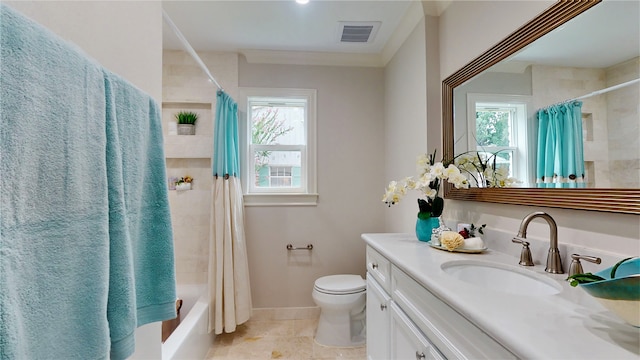 full bathroom with tile patterned flooring, shower / bath combo with shower curtain, toilet, and vanity