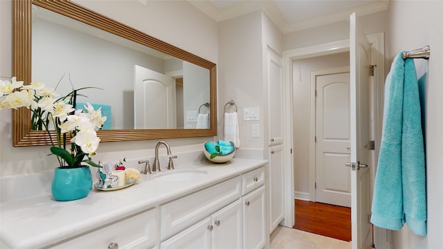 bathroom featuring hardwood / wood-style floors and vanity